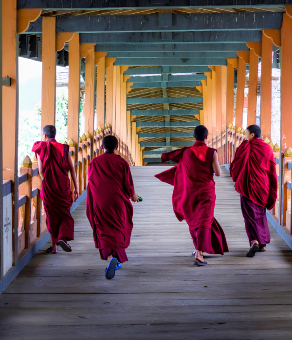 Monks at Punakha Dzong bridge Bhutan