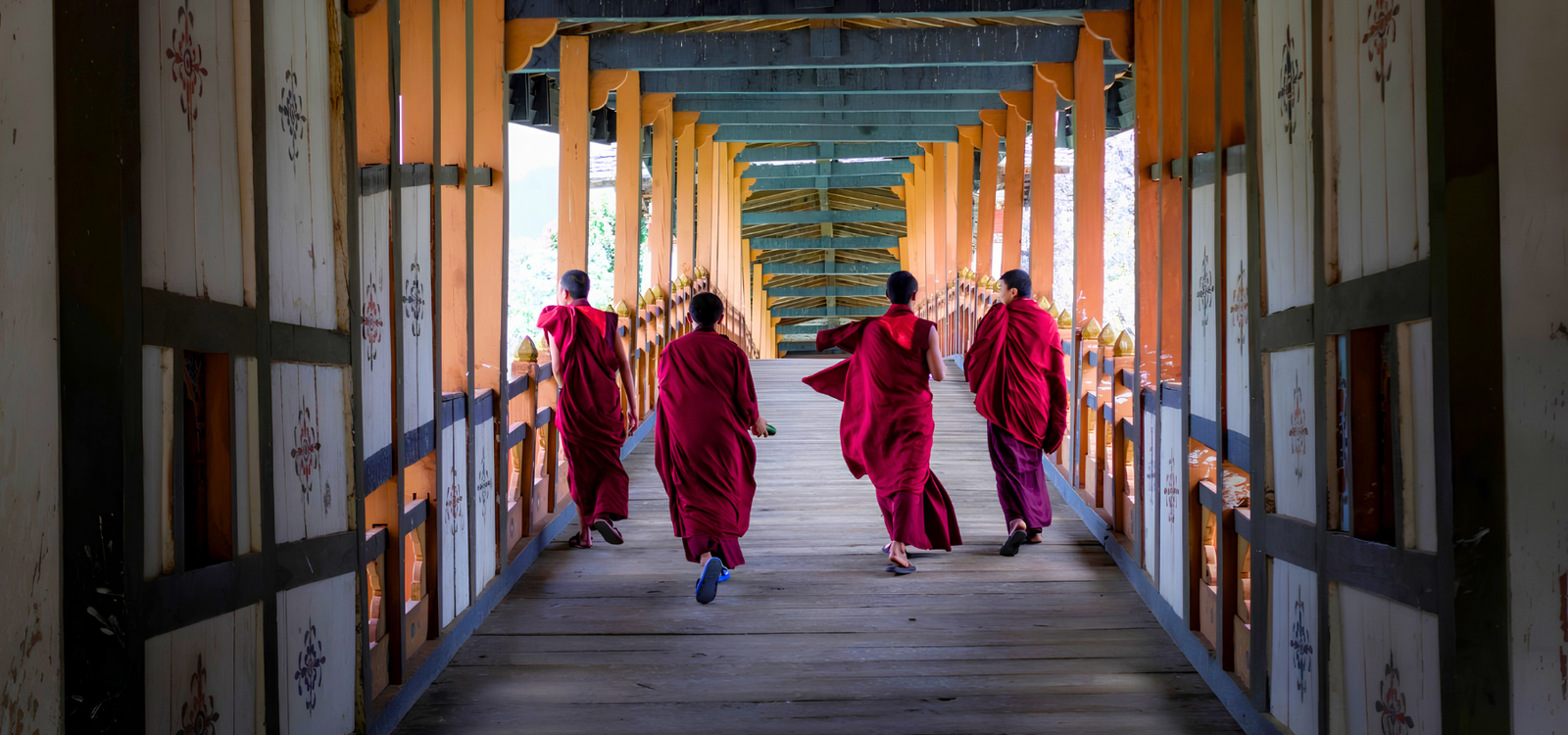 Monks at Punakha Dzong bridge Bhutan